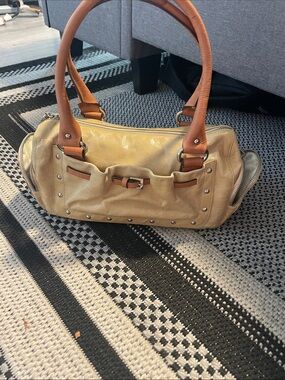 Leather Dissona Satchel Handbag in Tan/yellowish with Brown Handles